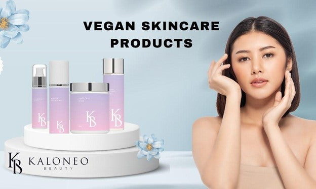 Kaloneo Beauty vegan skincare products banner showing bottles and a jar beside a woman touching her face