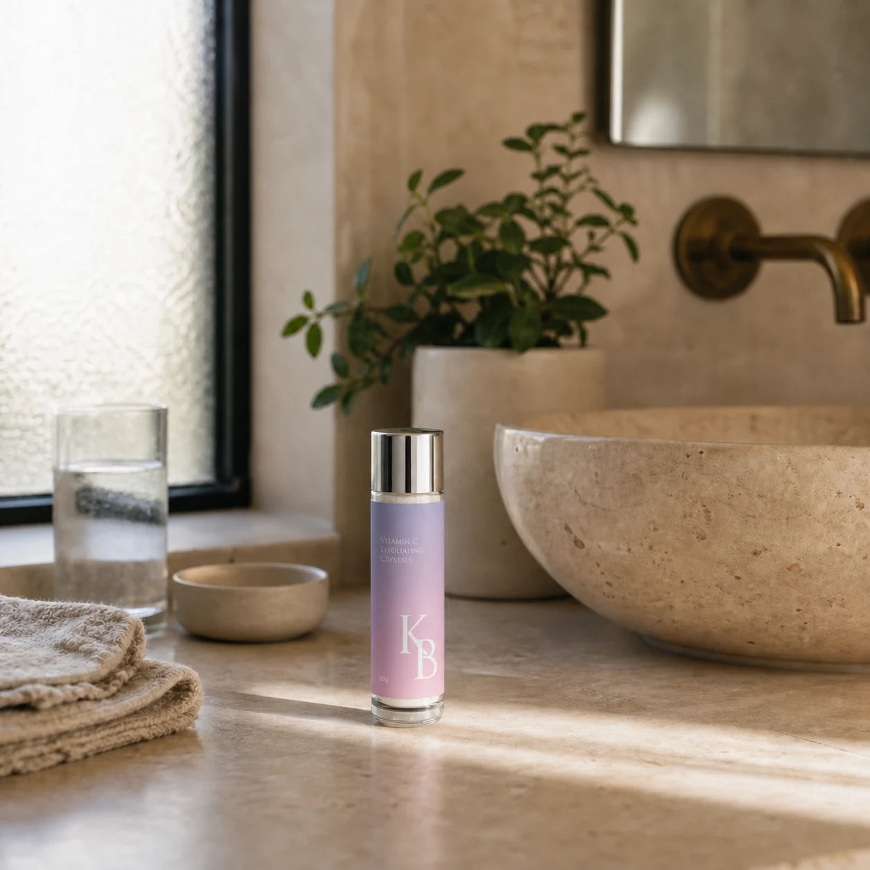 Kaloneo Beauty Vitamin C Exfoliating Crystals 50g on an Australian bathroom vanity beside the basin in warm morning light