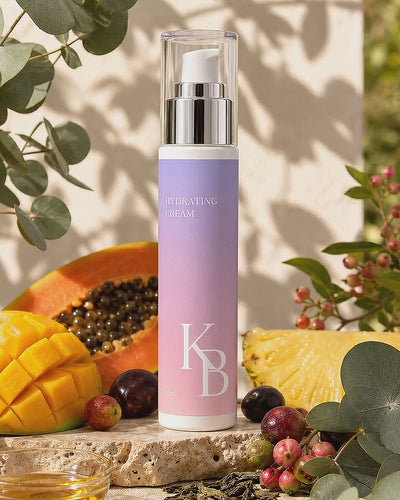 Kaloneo Beauty Hydrating Cream on travertine stone surrounded by fresh mango, papaya, pineapple and native Australian botanicals in soft morning daylight - portrait product film with music