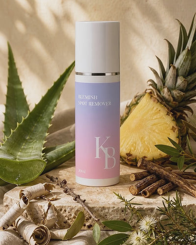 Kaloneo Beauty Blemish Spot Remover on travertine stone surrounded by aloe vera, pineapple, white willow bark, licorice root, lemon myrtle and tea tree in warm morning daylight - portrait product film with music