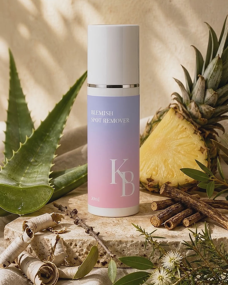 Kaloneo Beauty Blemish Spot Remover on travertine stone surrounded by aloe vera, pineapple, white willow bark, licorice root, lemon myrtle and tea tree in warm morning daylight - portrait product film with music